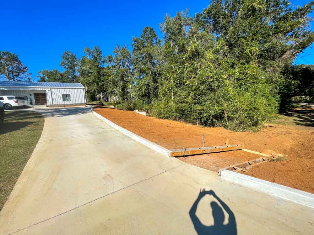A driveway, transformed by concrete resurfacing, radiating a sense of modernity and durability